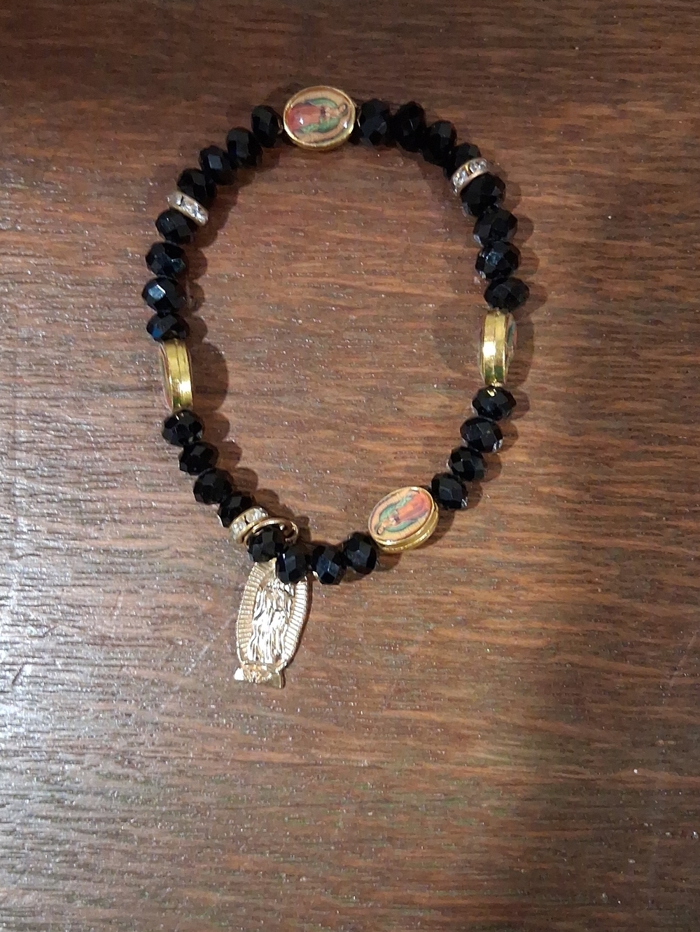 Black Faceted Bead Bracelet with Gold Virgin Mary Accents